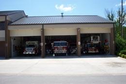 Mountain Home fire department station on South Hickory St, with 3 fire trucks in the bays
