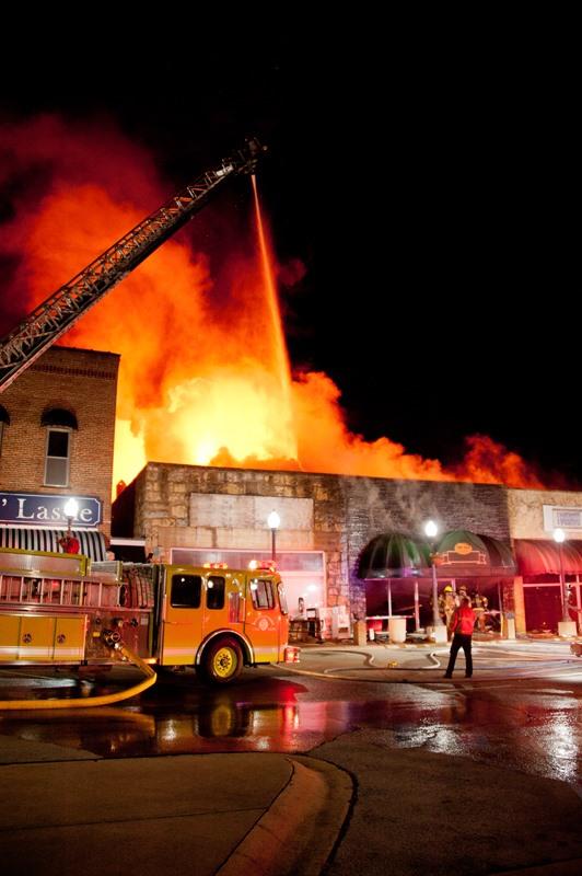 Ladder truck in front of fully engulfed Old Time Cafe